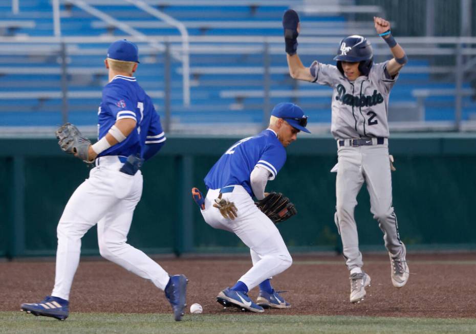 Damonte Ranch High's Ayden Grace (2) avoids a tag as Bishop Gorman High's Maddox Riske (2) drop ...