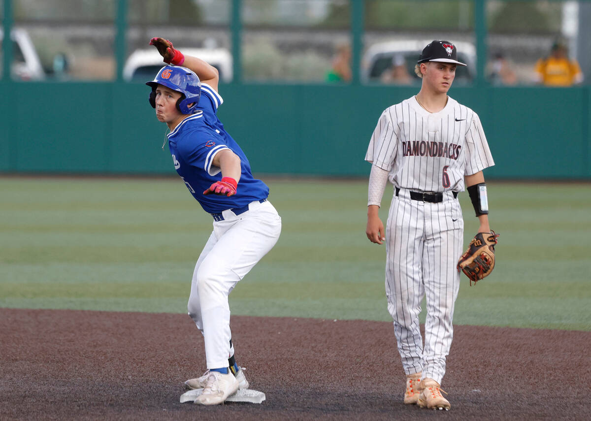 Bisho Gorman's Burke Mabeus reacts after hitting a double against Desert Oasis High as infielde ...