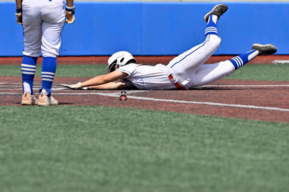 Bishop Gorman’s Raelynne Brown slides safely home during the first inning against Silver ...