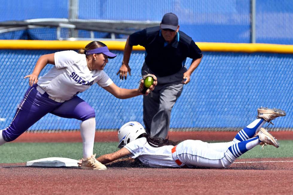 Bishop Gorman’s Allie Bernardo slides safely under the tag at third base against Silvera ...