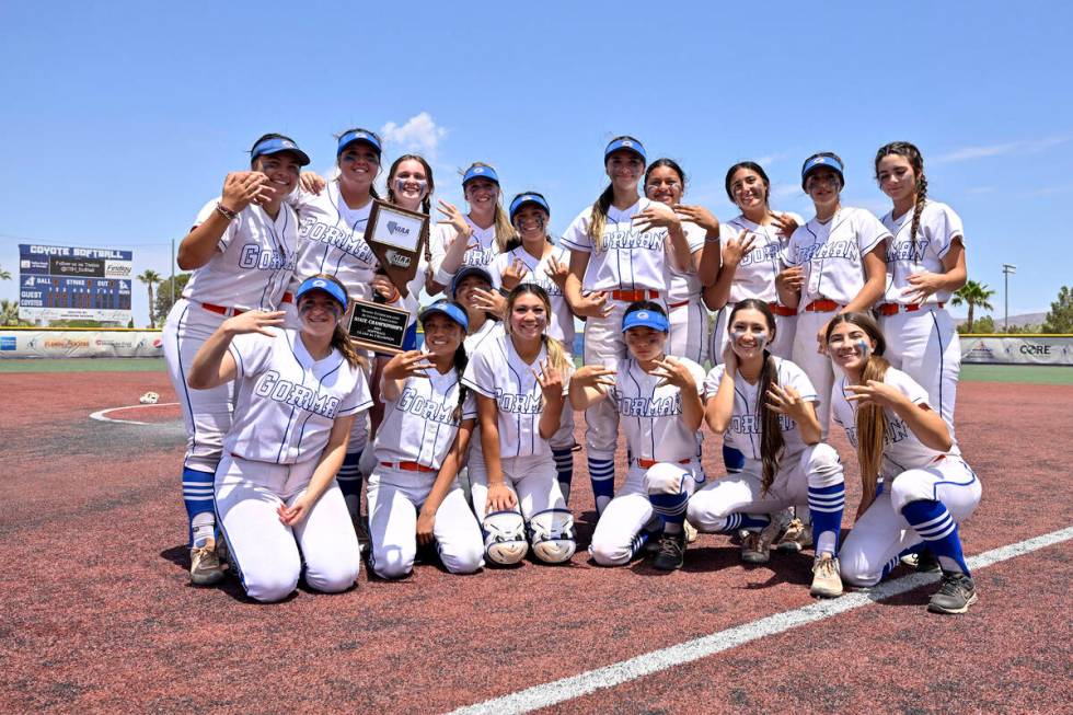 Bishop Gorman poses with the championship trophy after defeating Silverado 12-7, in the 4A stat ...