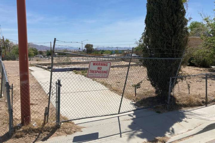 A fence lines an uneven foundation where a home once stood in the Windsor Park neighborhood of ...