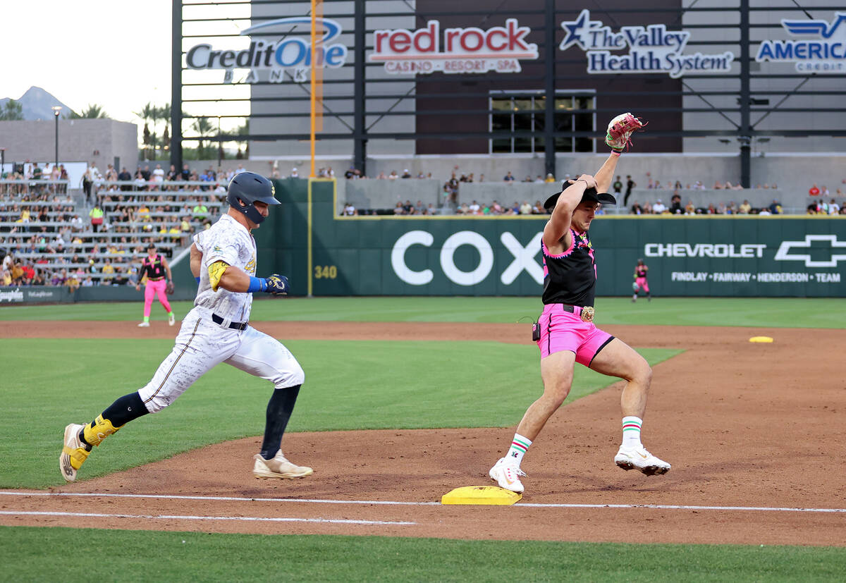 Party Animals’ Garett Delano makes an out at first base after Savannah Bananas’ M ...