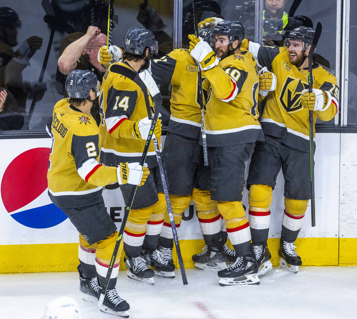 Teammates swarm Golden Knights center William Karlsson (71) after a score against Dallas Stars ...