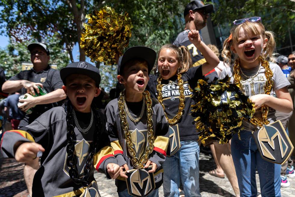 Kane Dorsey, 7, left, Brayden Dorsey, 7, Kennedy Livingston, 7, and Avery Bloch, 6, cheer for t ...