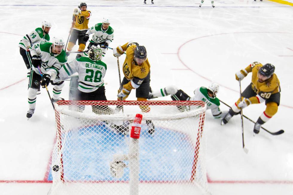 Golden Knights center Chandler Stephenson (20) scores the game-winning goal on Dallas Stars goa ...