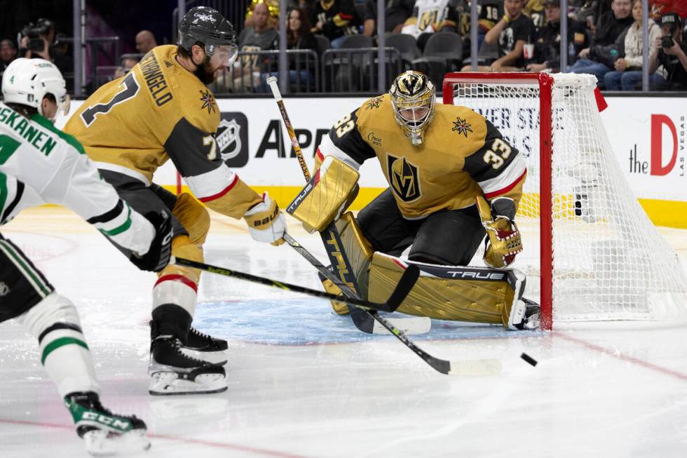 Golden Knights defenseman Alex Pietrangelo (7) blocks the puck before it reaches goaltender Adi ...