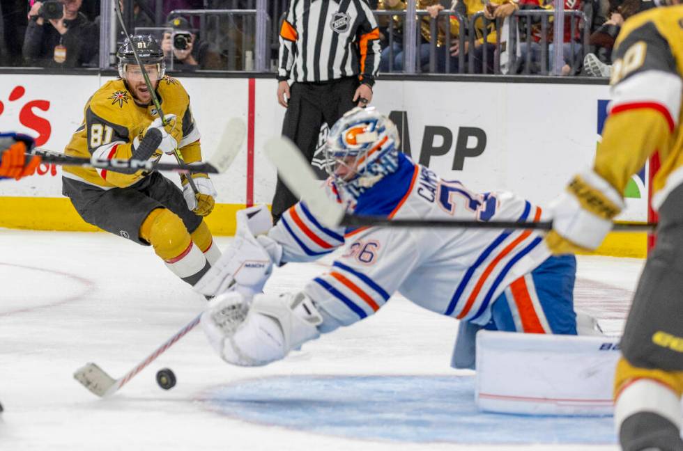 Golden Knights right wing Jonathan Marchessault (81) looks to a shot on goal being dove on by E ...