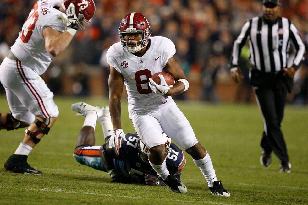 Alabama running back Josh Jacobs (8) runs the ball during the second half of the Iron Bowl NCAA ...