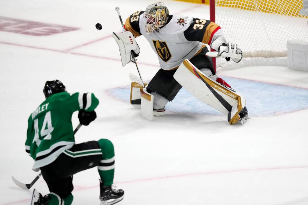 Vegas Golden Knights goaltender Adin Hill blocks a shot by Dallas Stars defenseman Joel Hanley ...