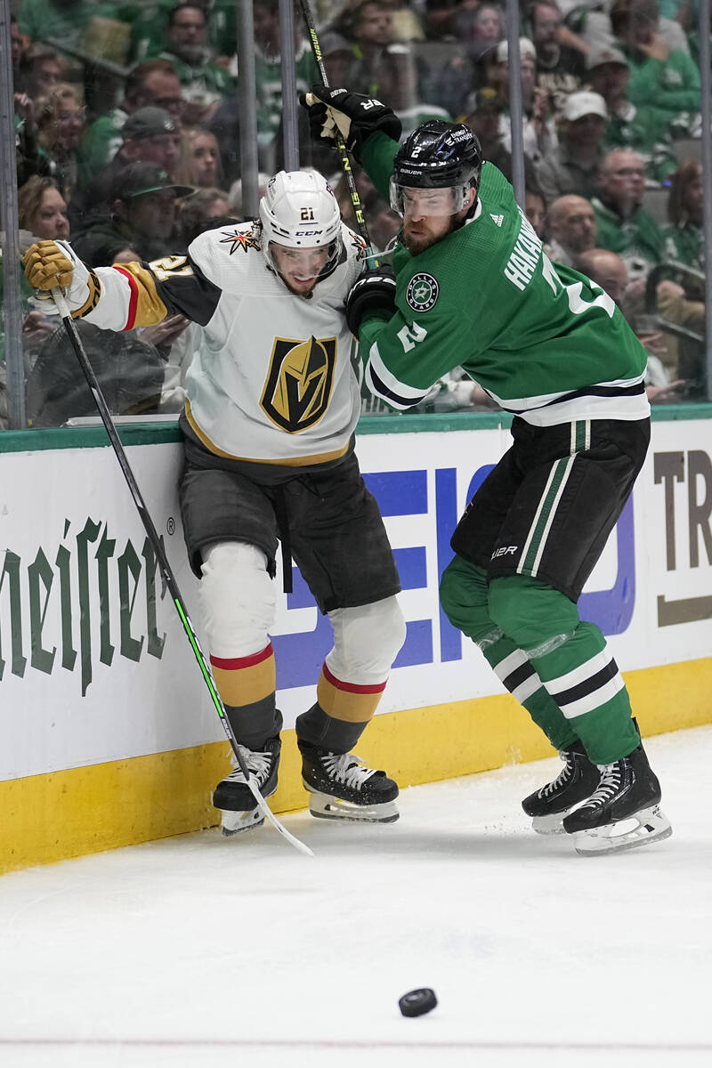 Vegas Golden Knights center Brett Howden (21) and Dallas Stars defenseman Jani Hakanpaa (2) com ...