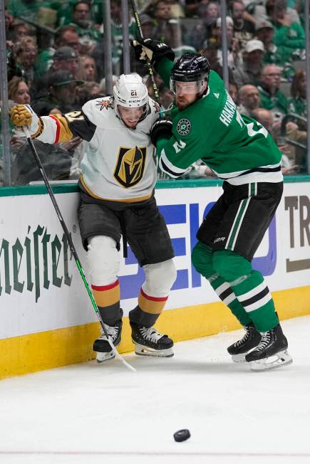 Vegas Golden Knights center Brett Howden (21) and Dallas Stars defenseman Jani Hakanpaa (2) com ...