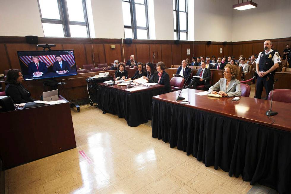 Former president Donald Trump, left on screen, and his attorney, Todd Blanche, right on screen, ...