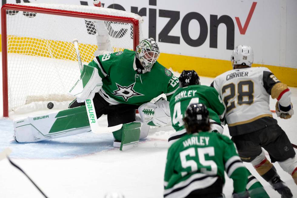 Golden Knights left wing William Carrier (28) scores a goal on Dallas Stars goaltender Jake Oet ...