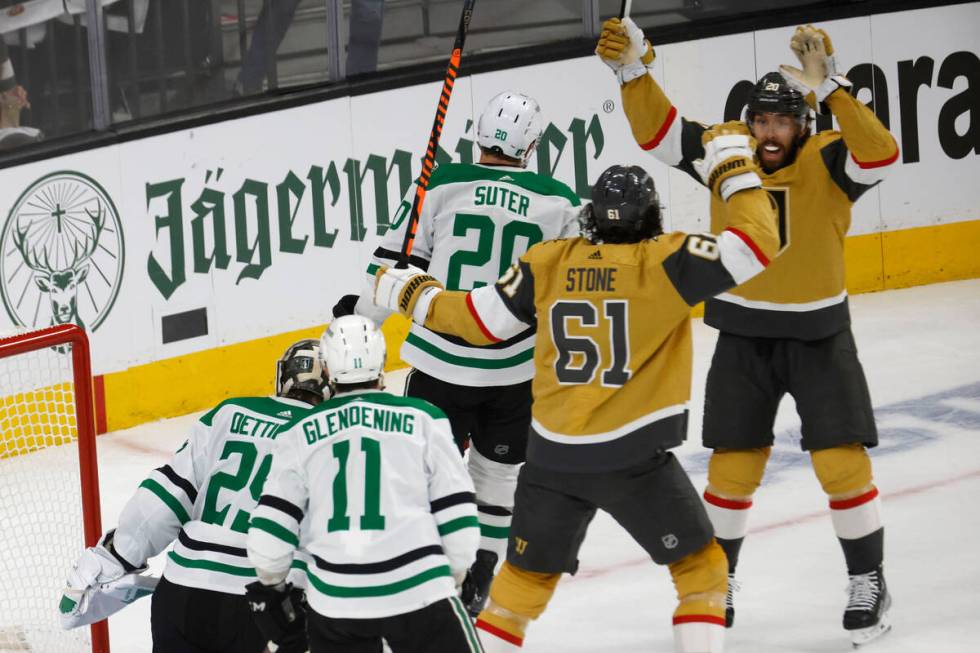 Golden Knights right wing Mark Stone (61) celebrates with his teammate center Chandler Stephens ...