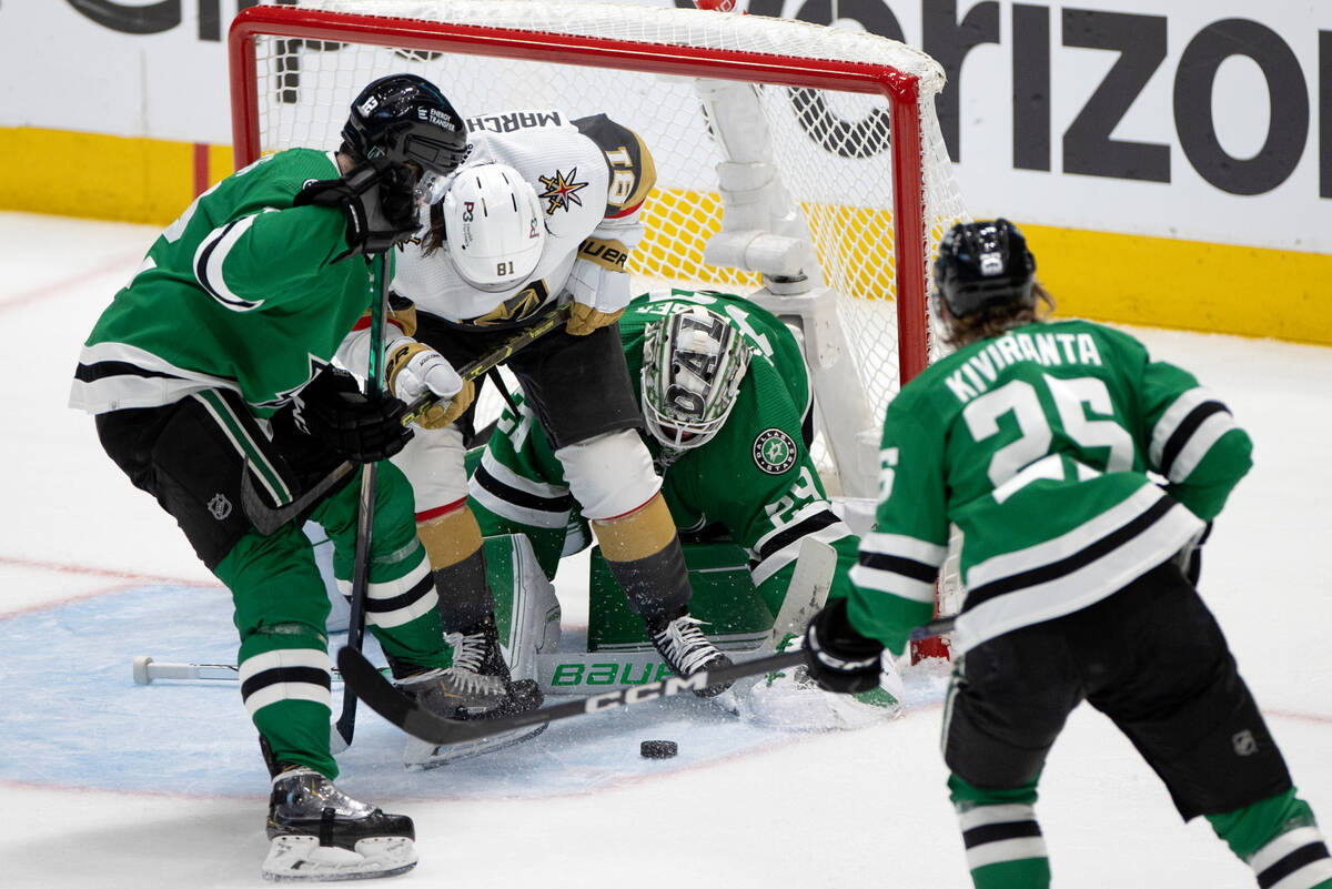 Golden Knights right wing Jonathan Marchessault (81) battles at the net with Dallas Stars cente ...