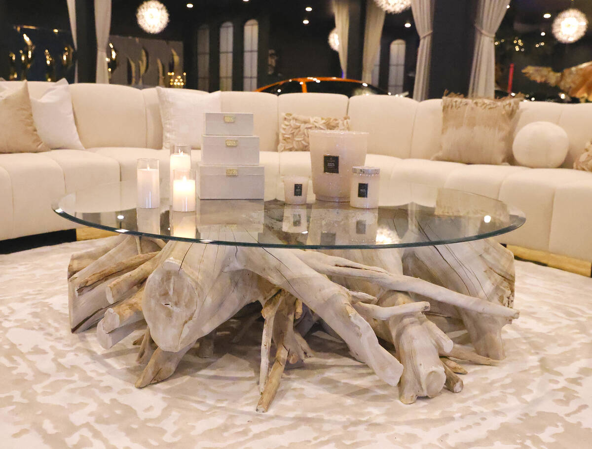 A coffee table and a leather sofa are displayed at Sanctuary Furniture, on Thursday, May 25, 20 ...