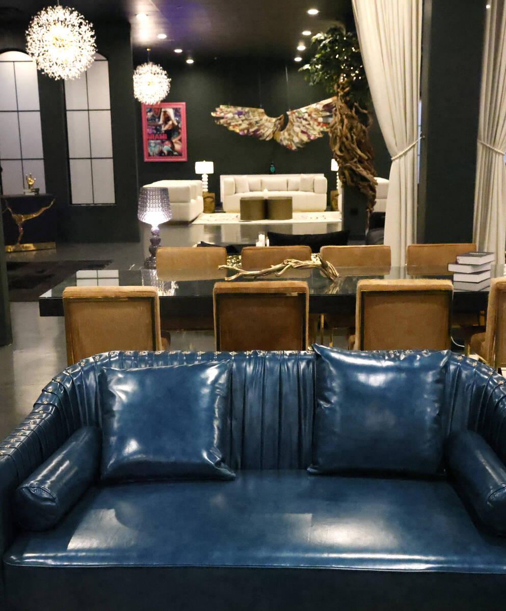 Dining table and a leather sofas are displayed at Sanctuary Furniture, on Thursday, May 25, 202 ...