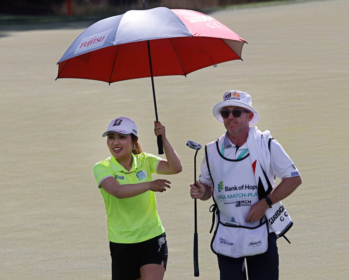Ayaka Furue of Japan smiles after she putted on the 13th green during the second day of round-r ...