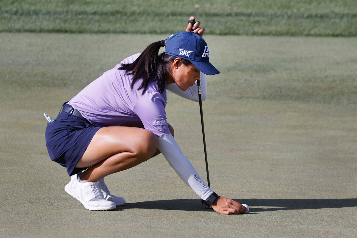 Celine Boutier of France lines up a putt on the 12th green during the second day of round-robin ...