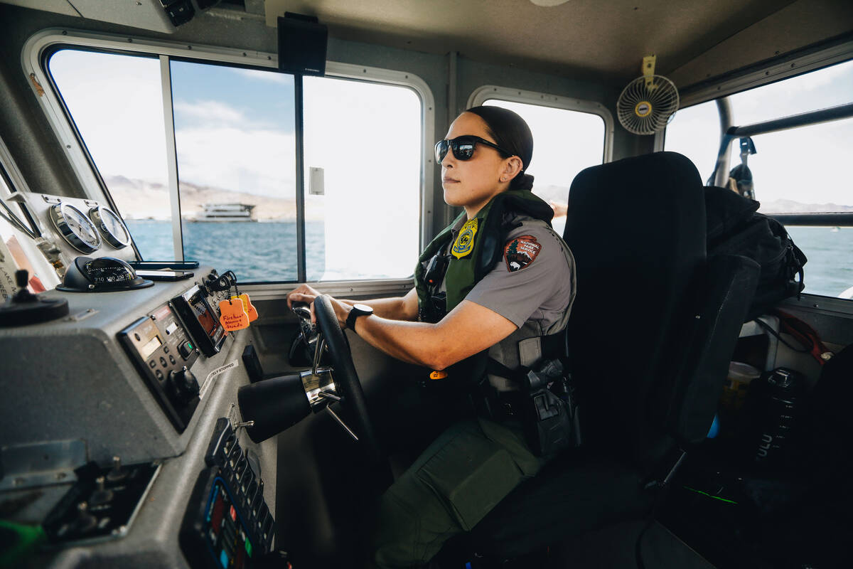 Park Ranger Justina Rosado steers a National Park Service fire boat on Wednesday, May 24, 2023, ...