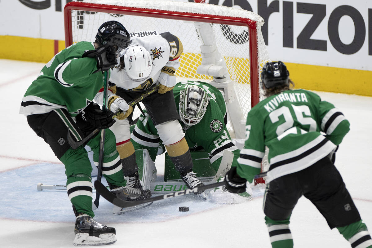 Golden Knights right wing Jonathan Marchessault (81) battles at the net with Dallas Stars cente ...