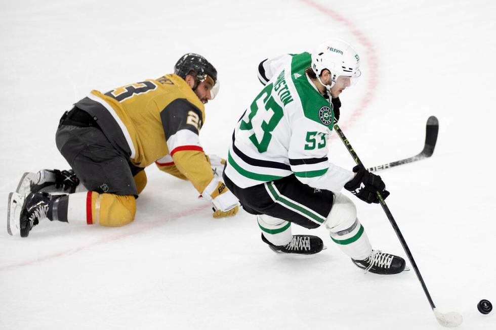 Golden Knights defenseman Alec Martinez (23) falls to the ice while skating against Dallas Star ...