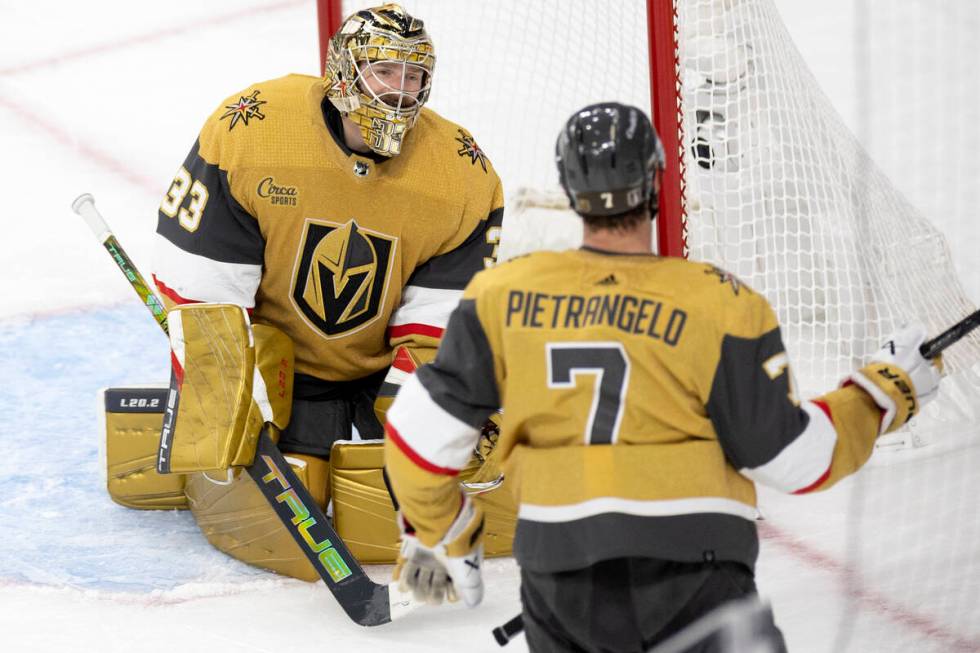 Golden Knights goaltender Adin Hill (33) reacts after the Dallas Stars scored on him while Knig ...