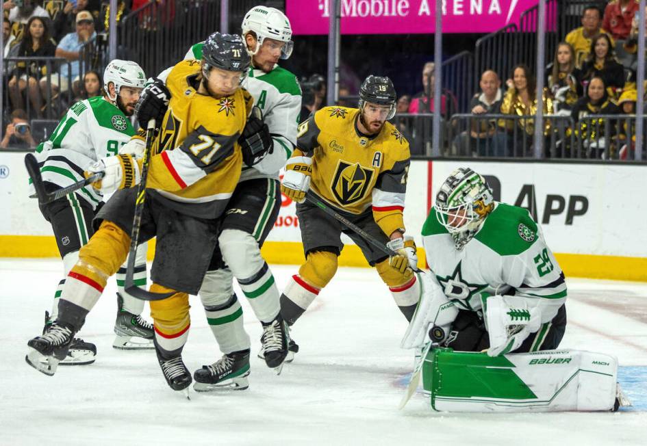 Golden Knights center William Karlsson (71) has a shot deflected by Dallas Stars goaltender Jak ...