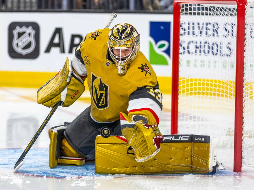 Golden Knights goaltender Adin Hill (33) reaches for another shot on goal by the Dallas Stars i ...