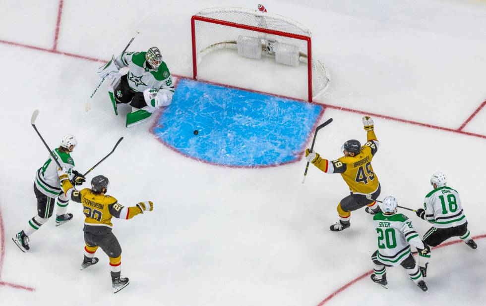 Golden Knights center Chandler Stephenson (20) and center Ivan Barbashev (49) celebrate a goal ...