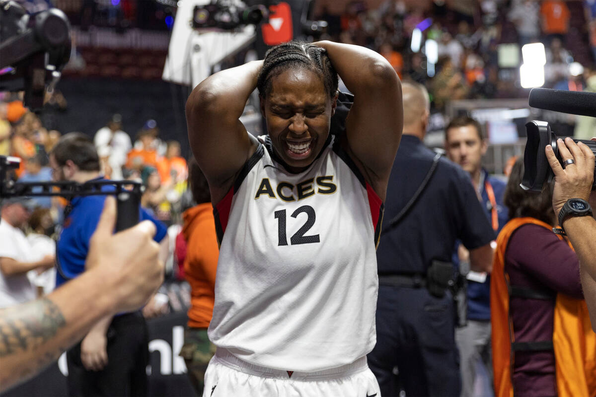 Las Vegas Aces guard Chelsea Gray (12) is in awe after her team won the 2022 WNBA Championship ...