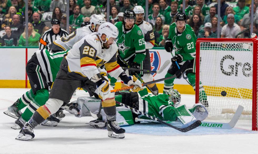 Golden Knights left wing William Carrier (28) shoots past Dallas Stars goaltender Jake Oettinge ...