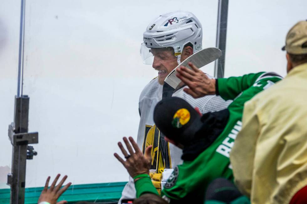 Golden Knights center Jack Eichel (9) is harassed by Dallas Stars fans on the way to the penalt ...