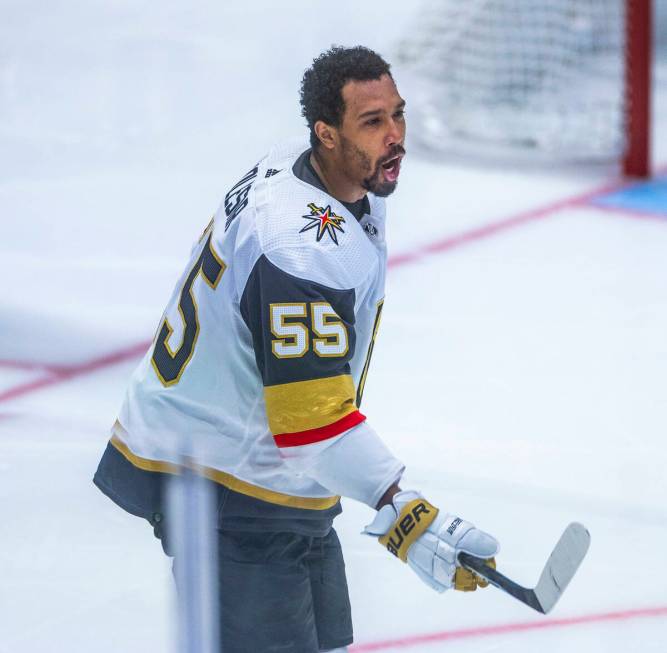 Golden Knights right wing Keegan Kolesar (55) reacts to his helmet being ripped off by the Dall ...