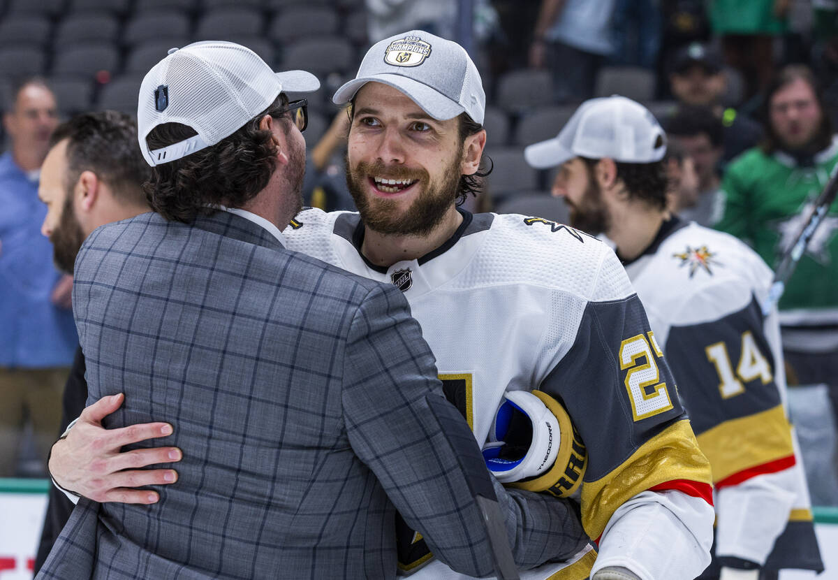 Golden Knights defenseman Shea Theodore (27) is congratulated on the ice after defeating the Da ...