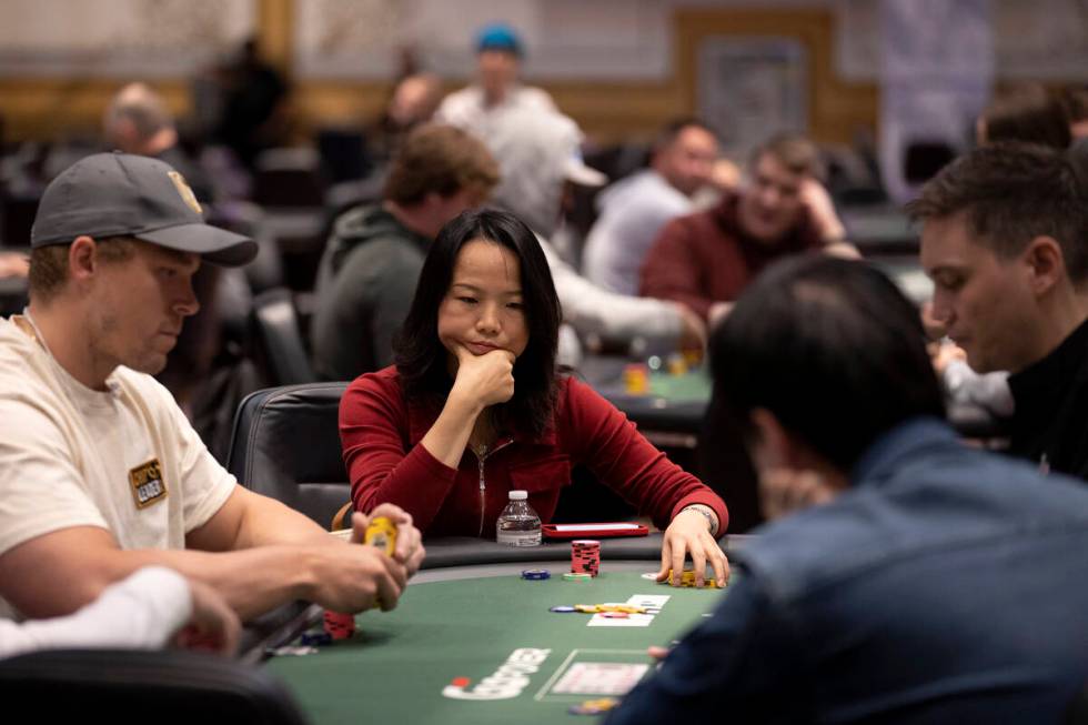 A player considers their turn during the first day of the World Series of Poker at Horseshoe La ...