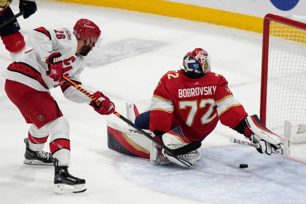 Carolina Hurricanes center Paul Stastny (26) shoots past Florida Panthers goaltender Sergei Bob ...