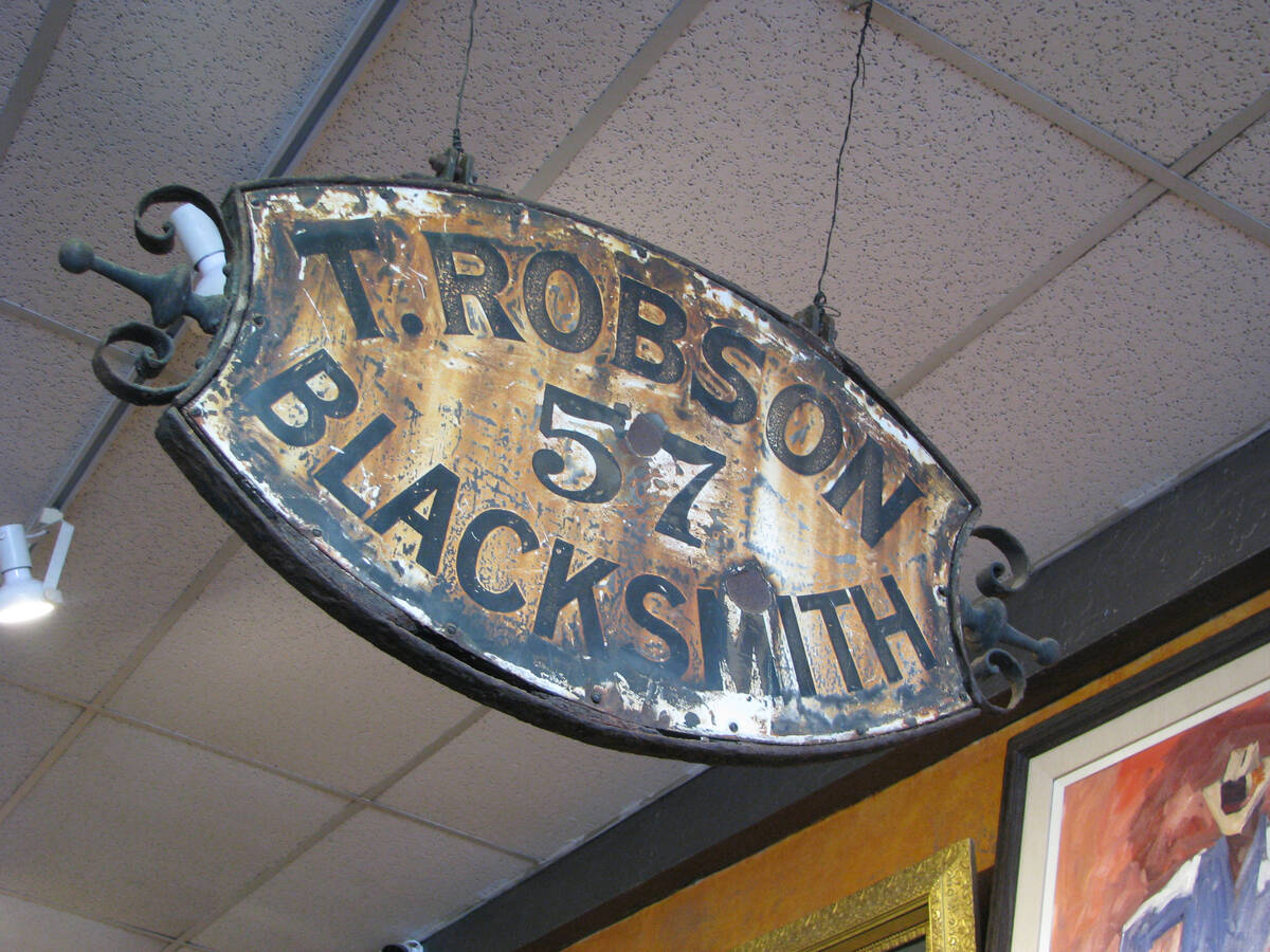 A blacksmith’s sign is one of several unusual items from Lonnie Hammargren’s collection tha ...
