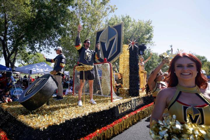 Vegas Golden Knights defenseman, Zach Whitecloud, left, and goaltender, Logan Thompson, center, ...