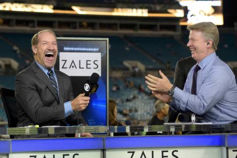 Thursday Night Football sportscasters Bill Cowher, left, and Phil Simms share a laugh during a ...