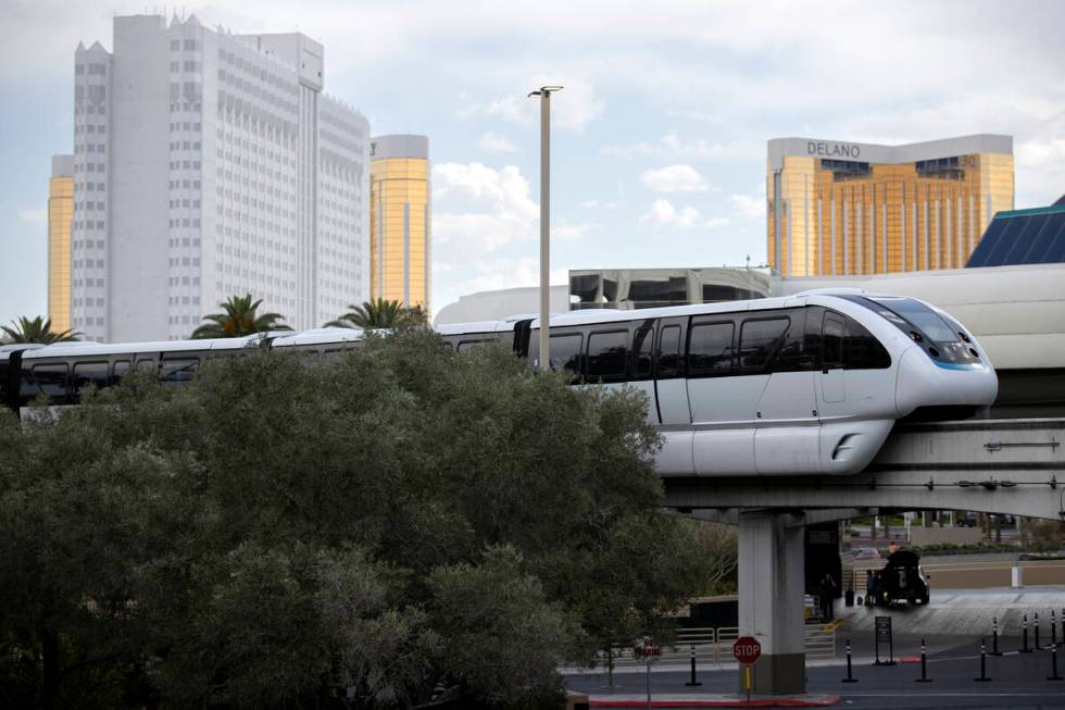 The Las Vegas Monorail travels near MGM Grand, with Tropicana in the background at left, on Wed ...