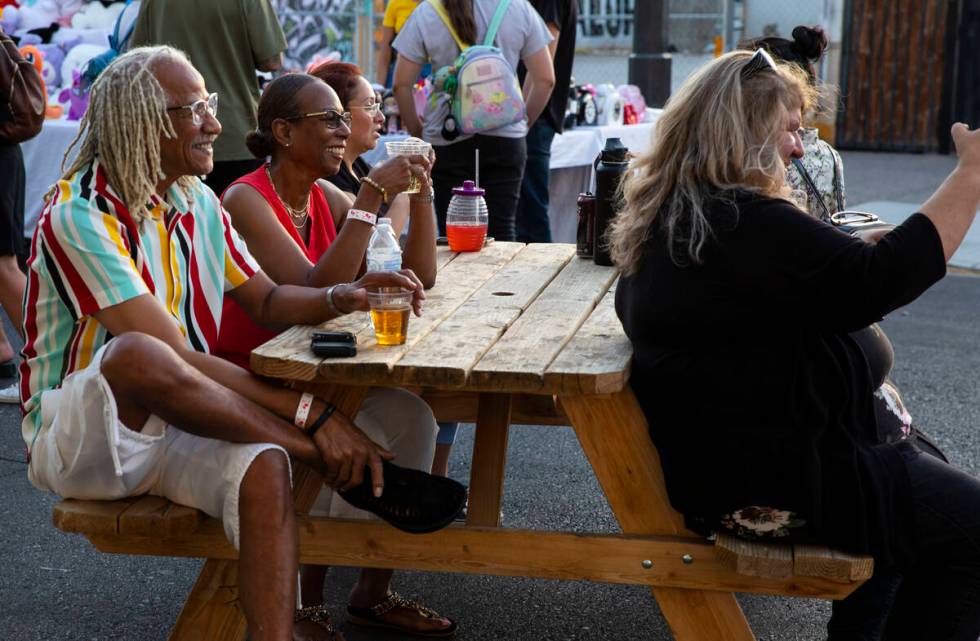 Ken, left, and Valerie Hicks pose for a selfie with Linda Lopez at the First Friday arts and fo ...