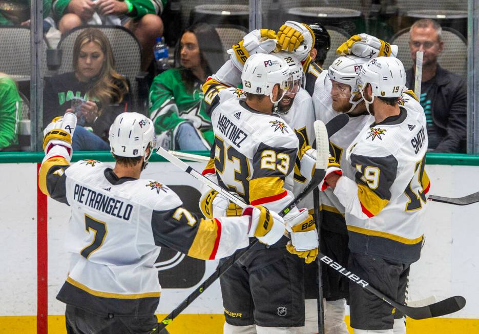 Golden Knights players celebrate a score against the Dallas Stars in the third period in Game 6 ...