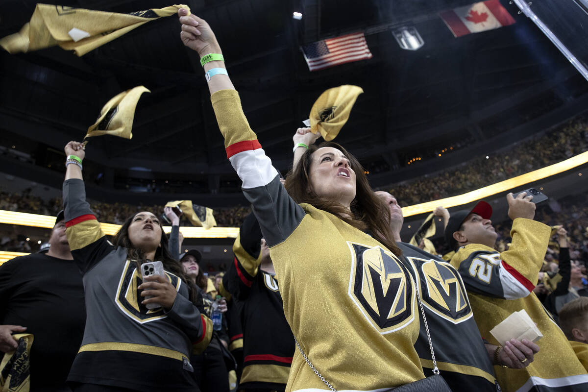 Golden Knights fans cheer for their team during the first period in Game 1 of the NHL hockey St ...