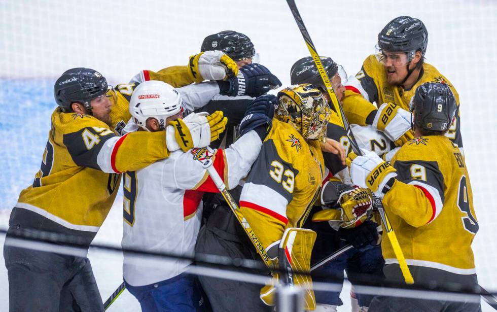 Golden Knights and Florida Panthers players fight during the first period in Game 1 of the NHL ...