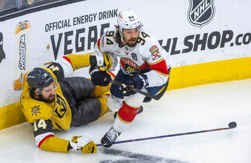 Golden Knights defenseman Nicolas Hague (14) mistaken down by Florida Panthers left wing Ryan L ...