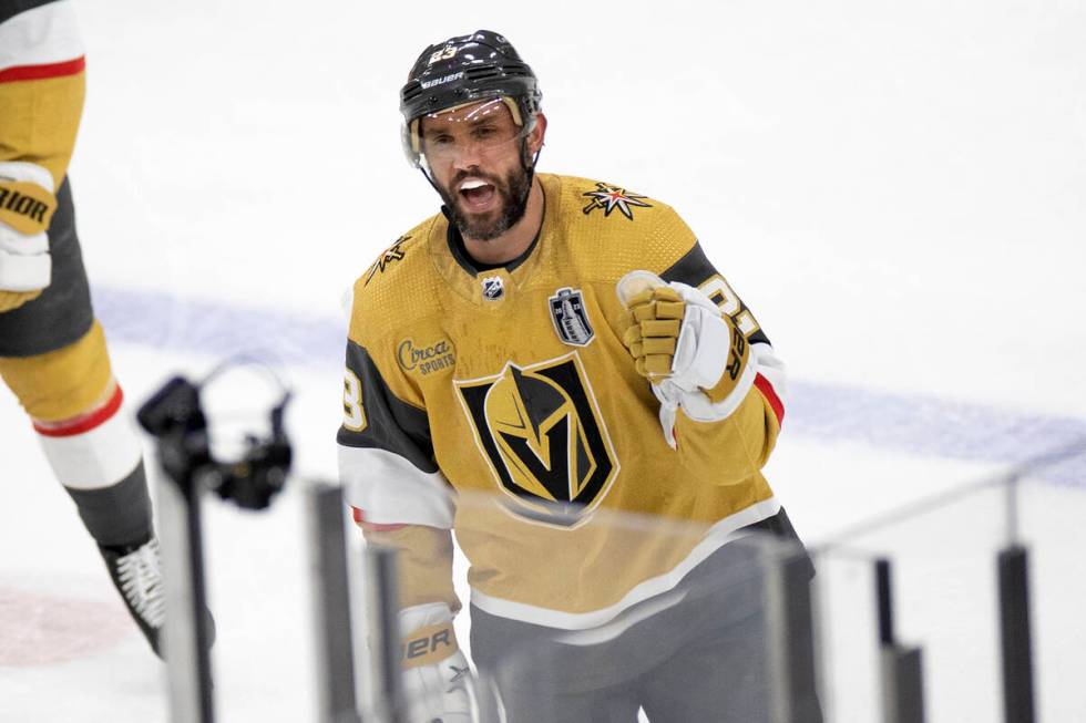 Golden Knights defenseman Alec Martinez (23) skates to the bench to be congratulated on his goa ...