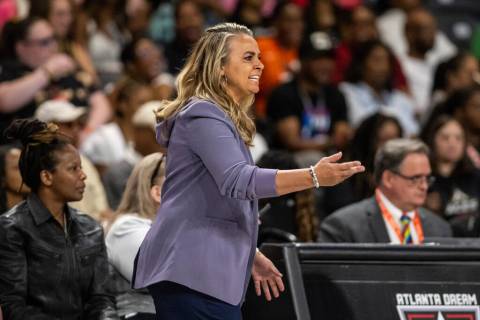 Las Vegas Aces head coach Becky Hammon works during a WNBA basketball game against the Atlanta ...