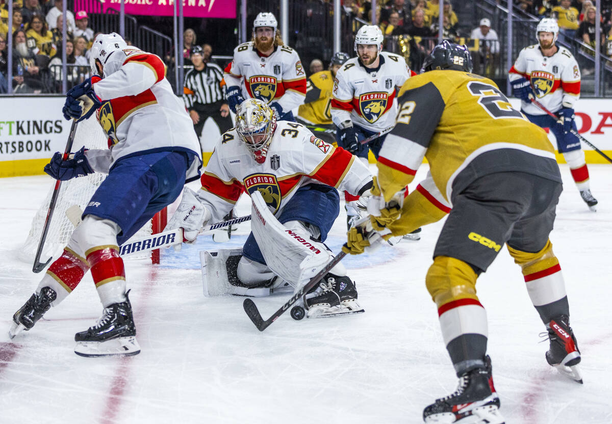 Florida Panthers goaltender Alex Lyon (34) attempts to deflect the puck from Golden Knights rig ...